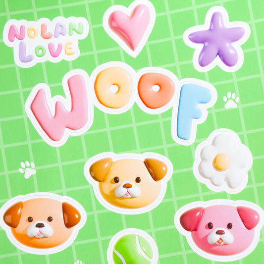 Colorful stickers with dogs, hearts, stars, and tennis ball on a green grid background with 'Nolan Love' branding.
