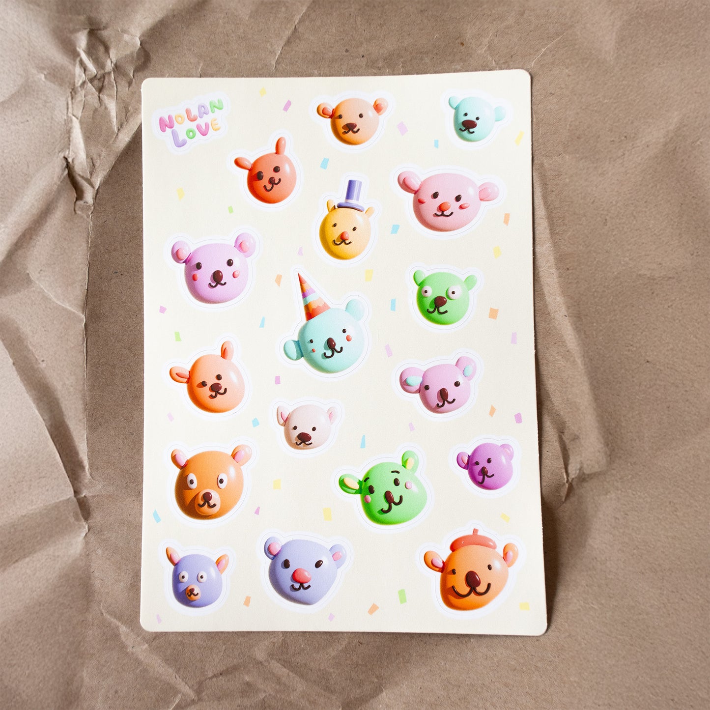 Sheet of colorful bear stickers on a brown paper background