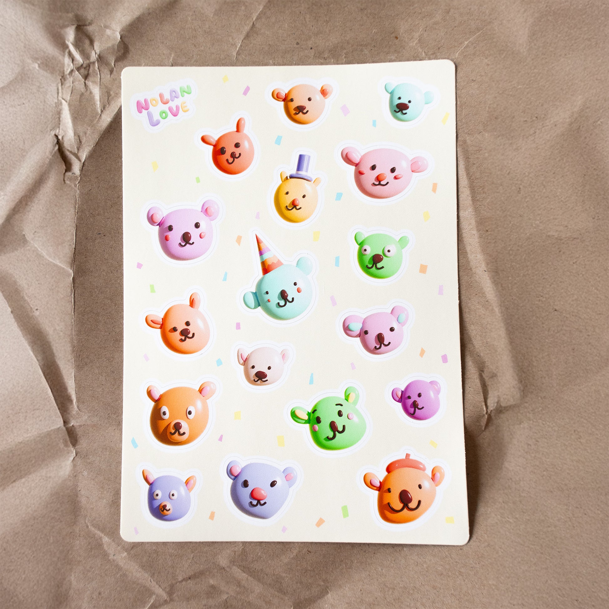 Sheet of colorful bear stickers on a brown paper background