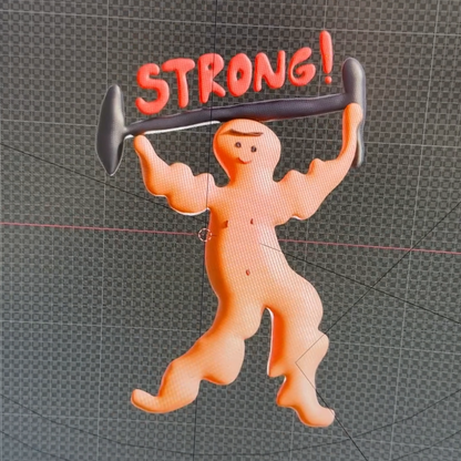Behind the scenes video of the making of cartoon character lifting weights with bold 'STRONG!' text on minimalist background – motivational art print